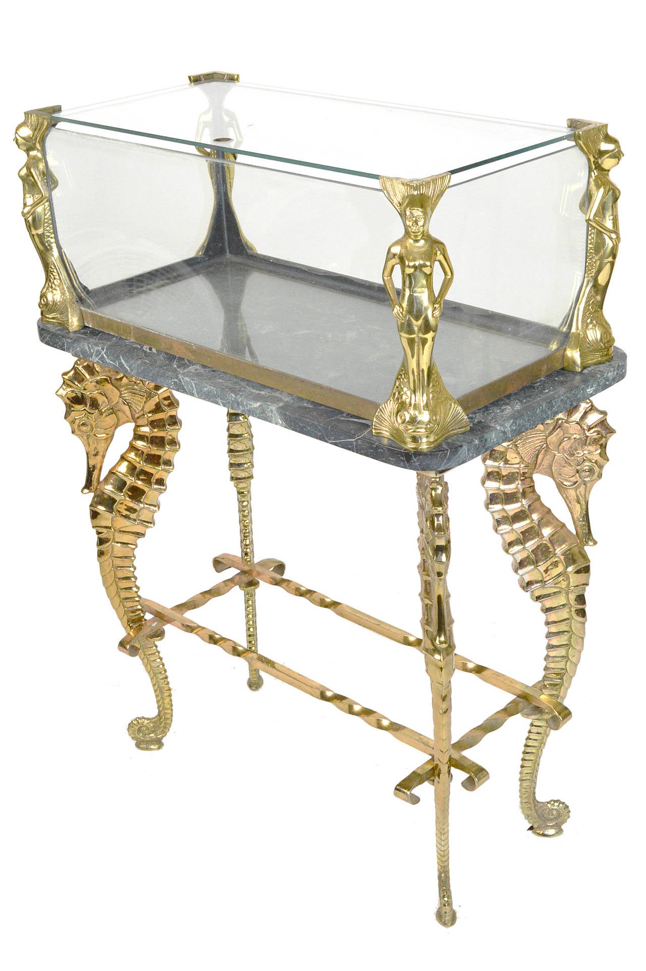 A fine brass seahorse aquarium on stand with mermaid mounts raised on a conforming base over seahorse form legs.