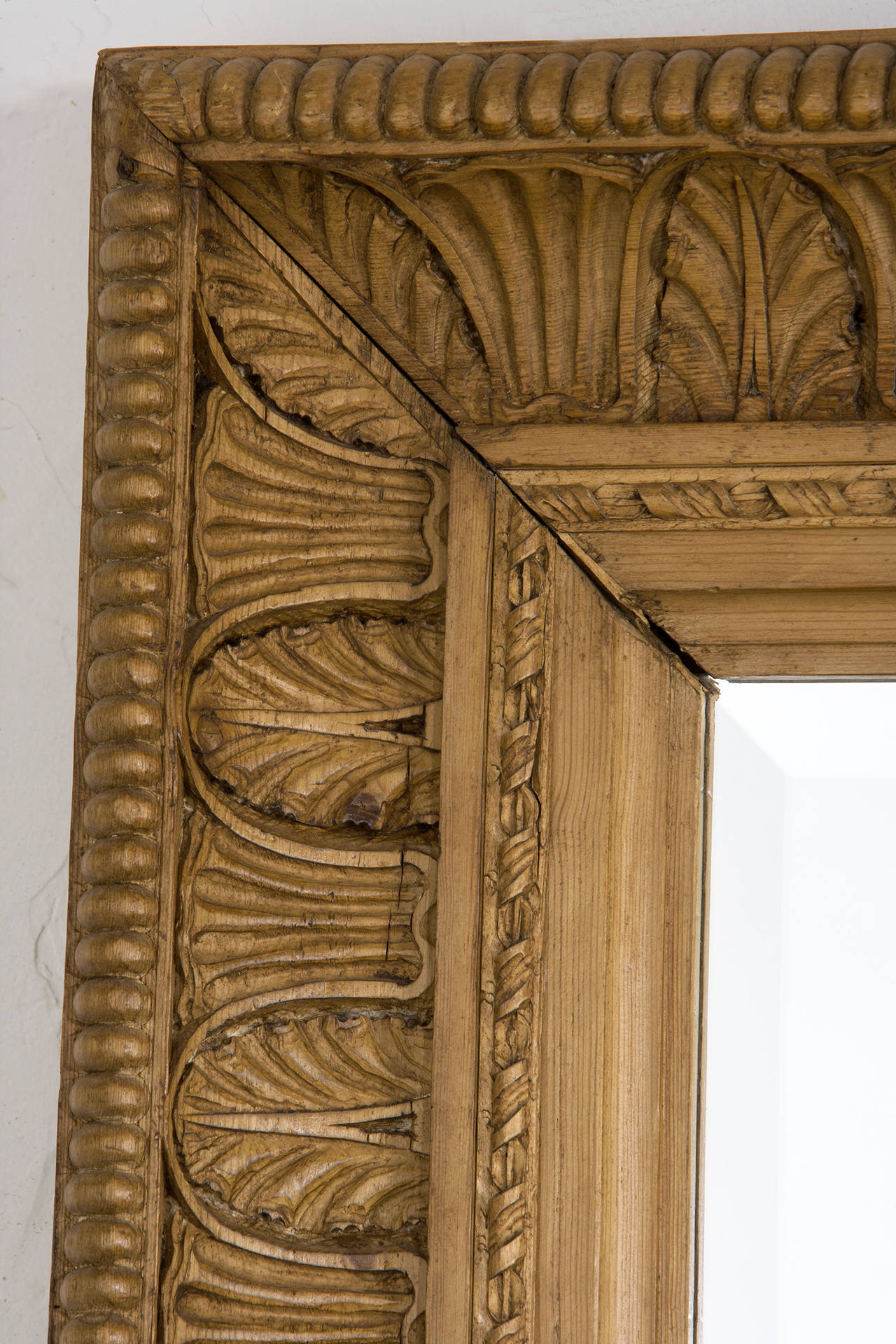 Irish carved pine mirror with bevel. 
Sold as is. Natural wood finish.
Detail carving as shown one of a kind.