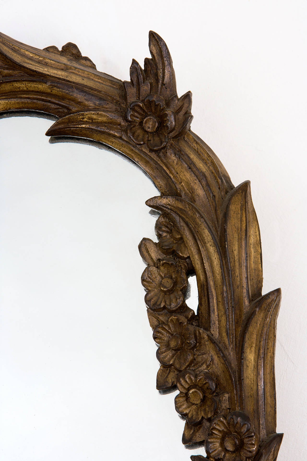 Climbing leaf walnut frame with clear mirror.
Overall size H. 51