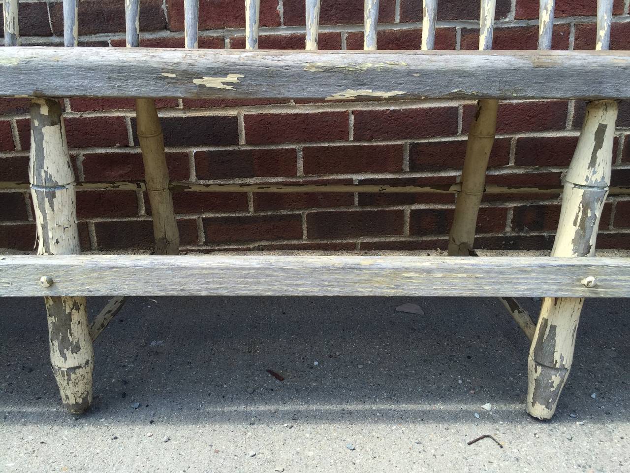 Have a seat.  With 15 of your closest friends.  Cozy up on a piece of Americana from New England.  This truly monumental in scale, rustic, spindle back Deacons bench sat at a train station for many moons and was surely a welcome sight for foot weary