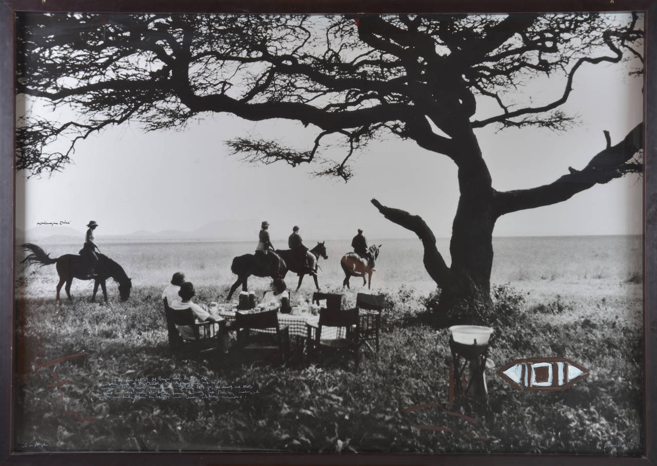 A beautiful framed photograph of a breakfast under the tree at Ol Donyo Wuas, Chyulu Hills, Tsavo, Kenya, taken by Alexis de Vilar in 1999. The photo is unique due its recorded memoires with white/black ink and paint. Framed with acrylic plexiglass