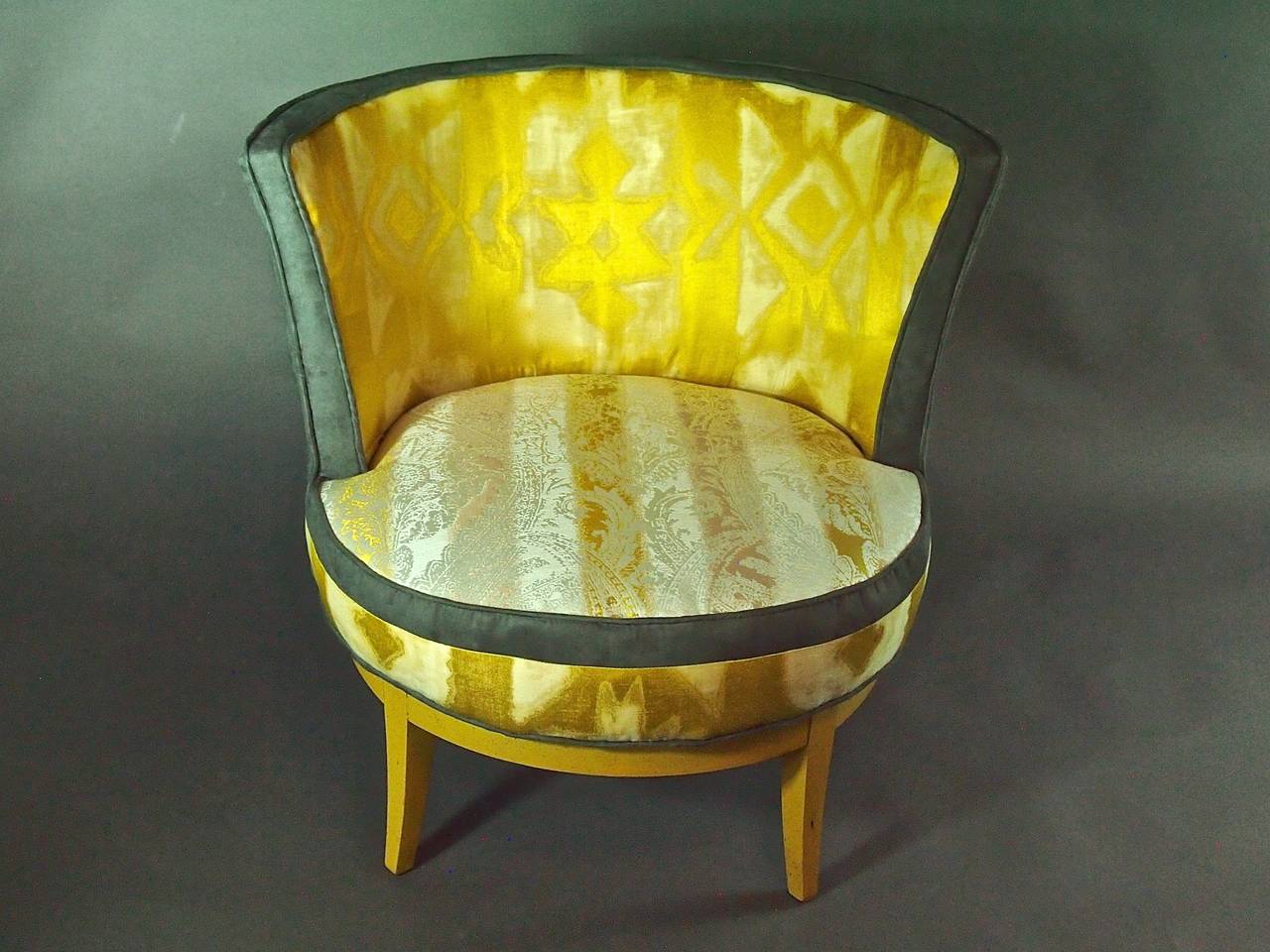 A small swivel chair that's truly worthy of a queen! Original yellow stained wood is enhanced by a royal yellow silk pulled tight to place a star in the center. Inspired by some of Napoleon's chairs I saw at the Louvre last summer. Fabric design is