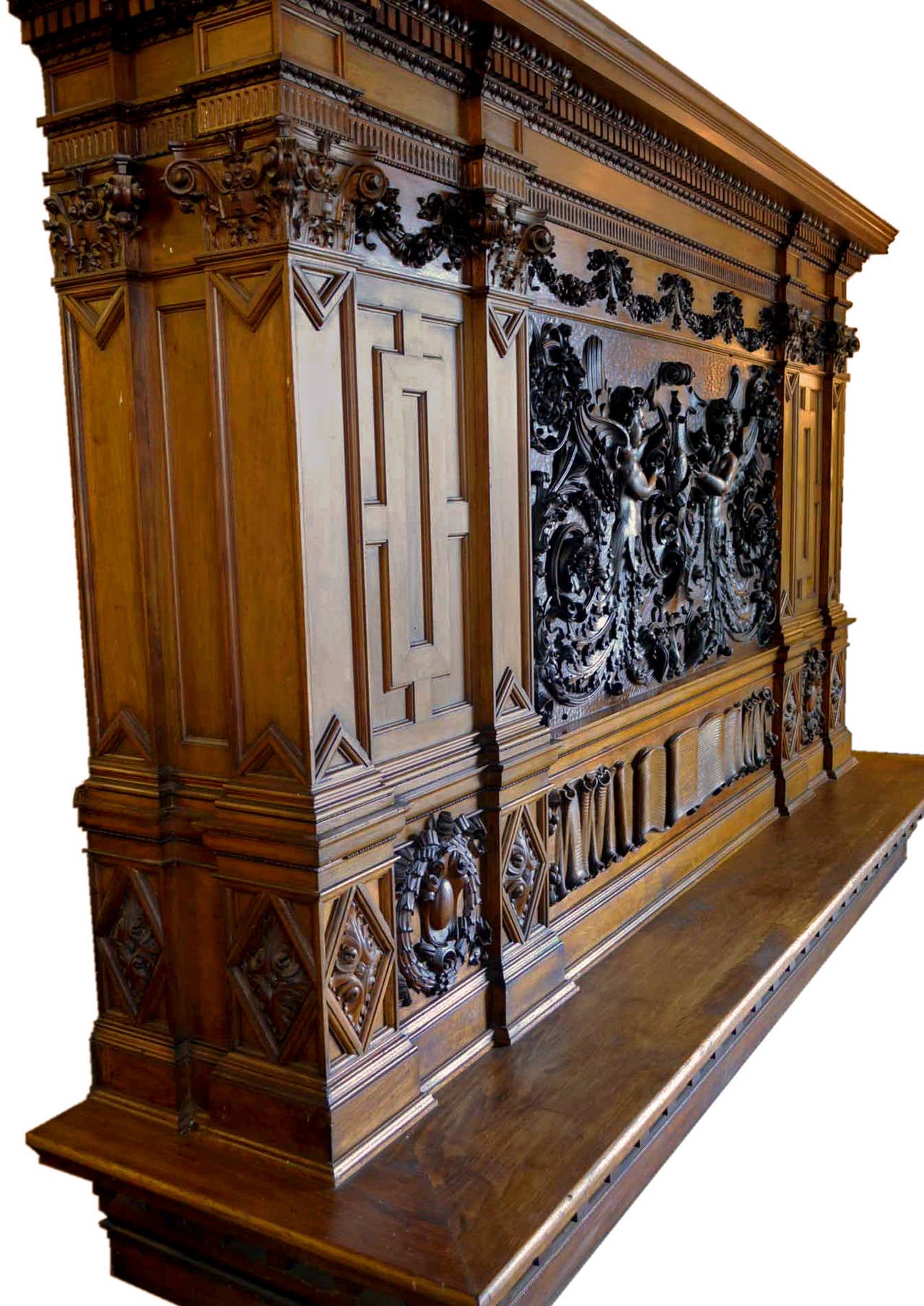 This hand-carved American beaux-art overmantel, created in the late 19th century is an superb example of American craftsmanship and originality. The creator infused classical Greco-Roman Architecture and the Italian Renaissance, as well as English