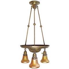 Antique Brass Three Light Fixture featuring Signed Louis Comfort Tiffany Favrile Shades