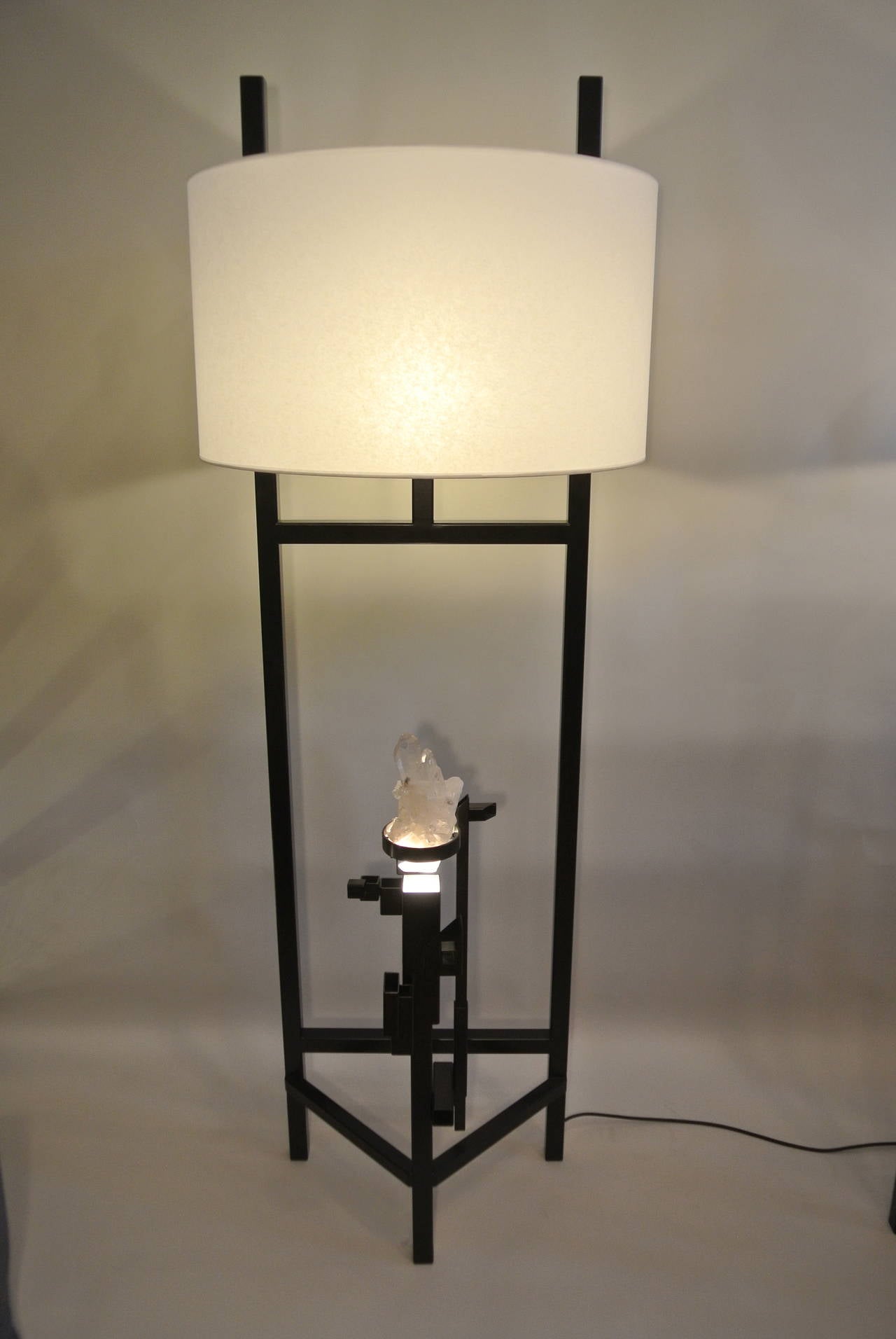 A pair of painted metal and rock crystal floor lamps of the 21st century. Measures: Height 1m 65 width 60 cm.