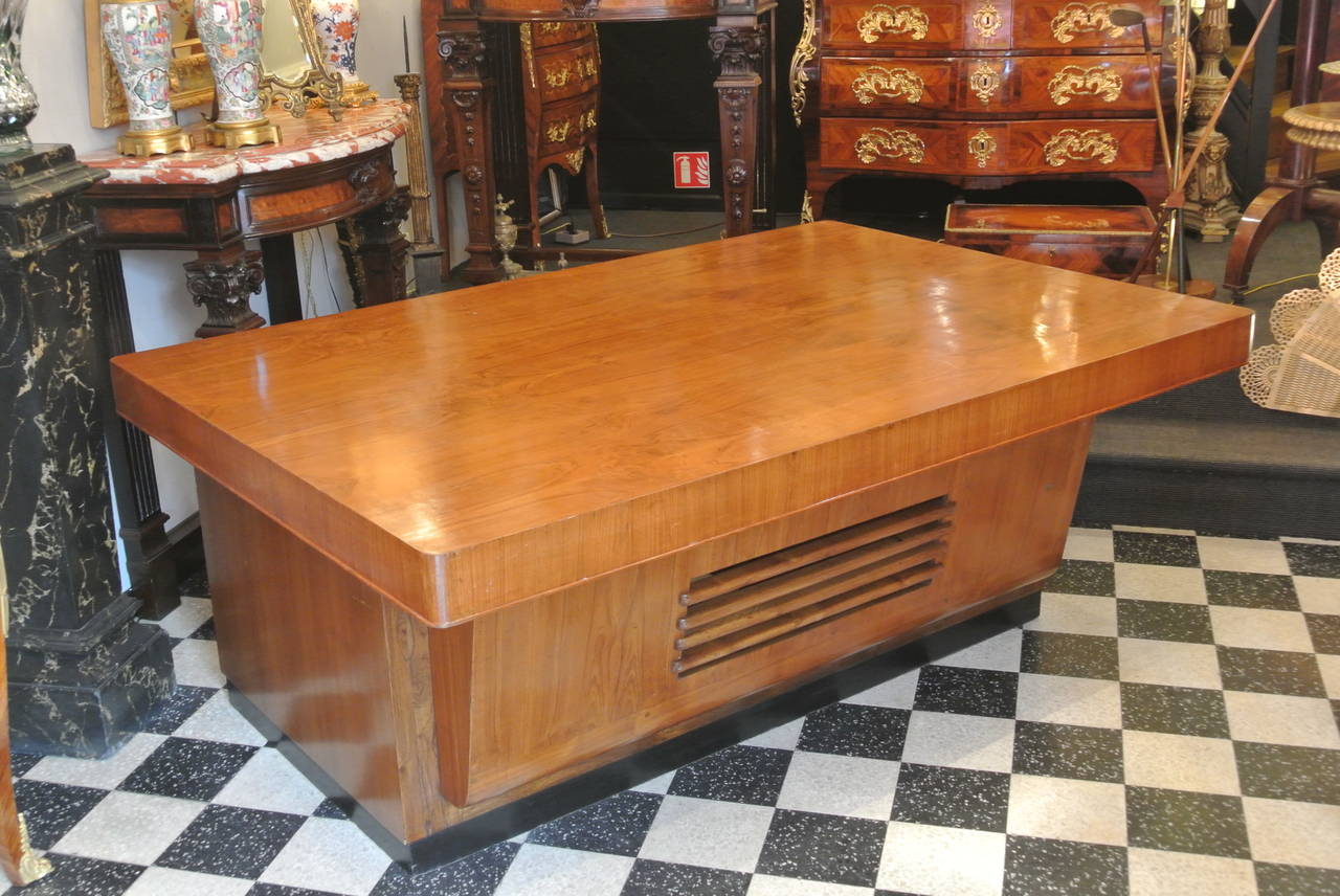 Superior quality Mid-Century Modern desk circa 1950 with three drawers, one cabinet, two pull-out surfaces all constructed out of exotic woods. A wonderful and unusual example of Mid-Century Modern.