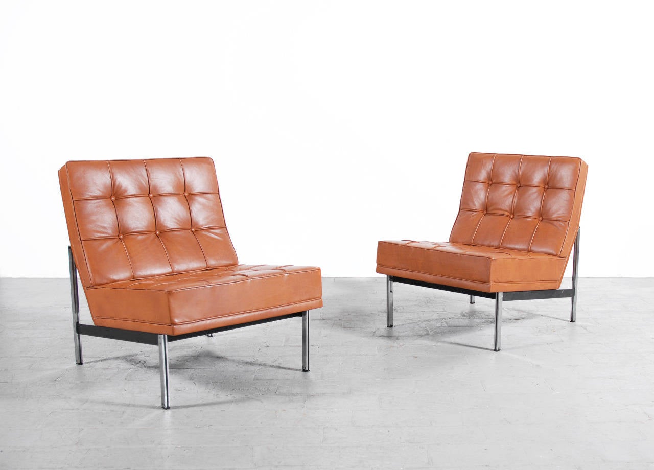 Pair of Parallel Bar Chairs by Florence Knoll produced by Knoll International.
Newly re-upholstered with brown leather.
Excellent condition.