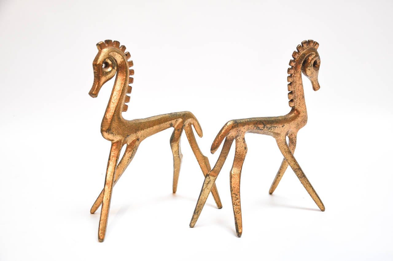 Pair of 1950s cast bronze horses designed by Frederick Weinberg. Both pieces are marked 