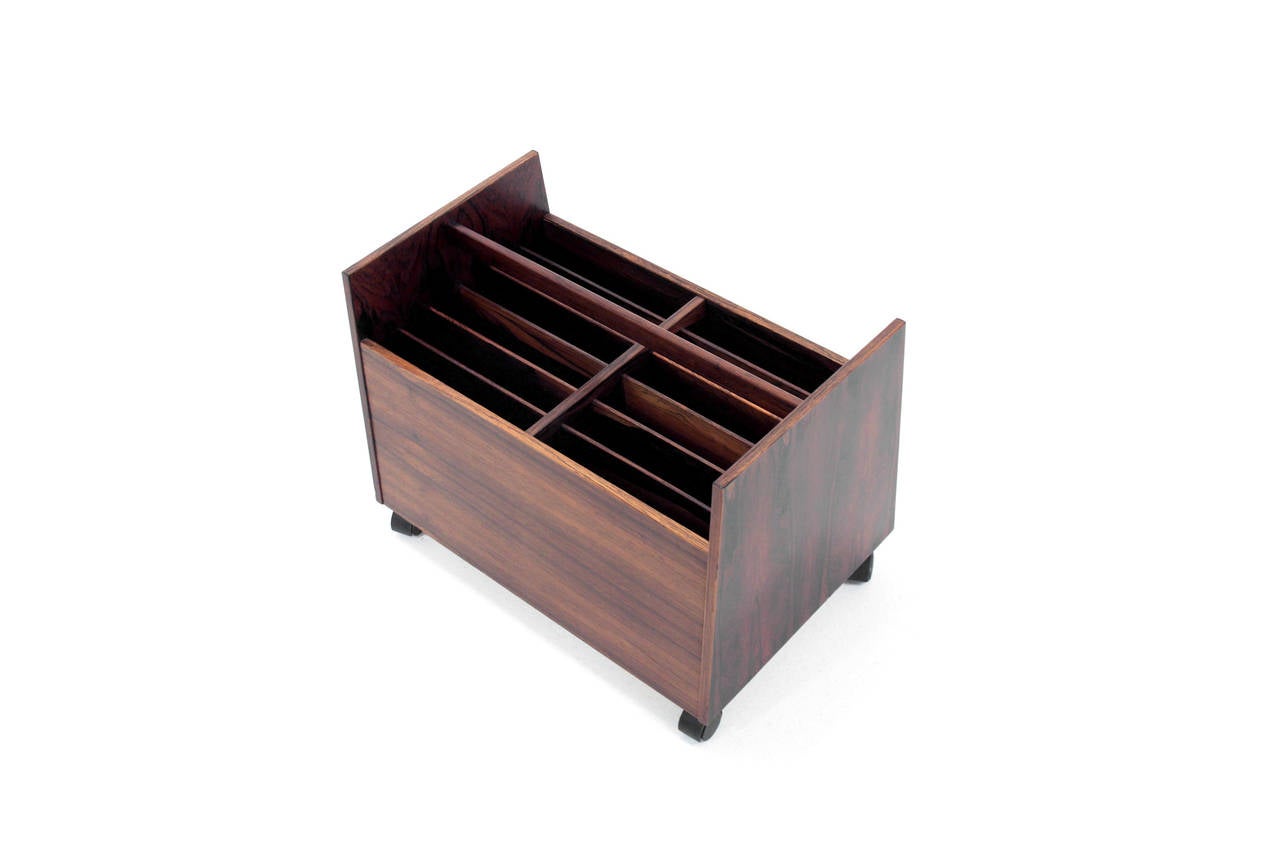 An excellent example of a large magazine rack in rosewood by Rolf Hesland. Manufactured in Norway by Bagn Snekkeri.