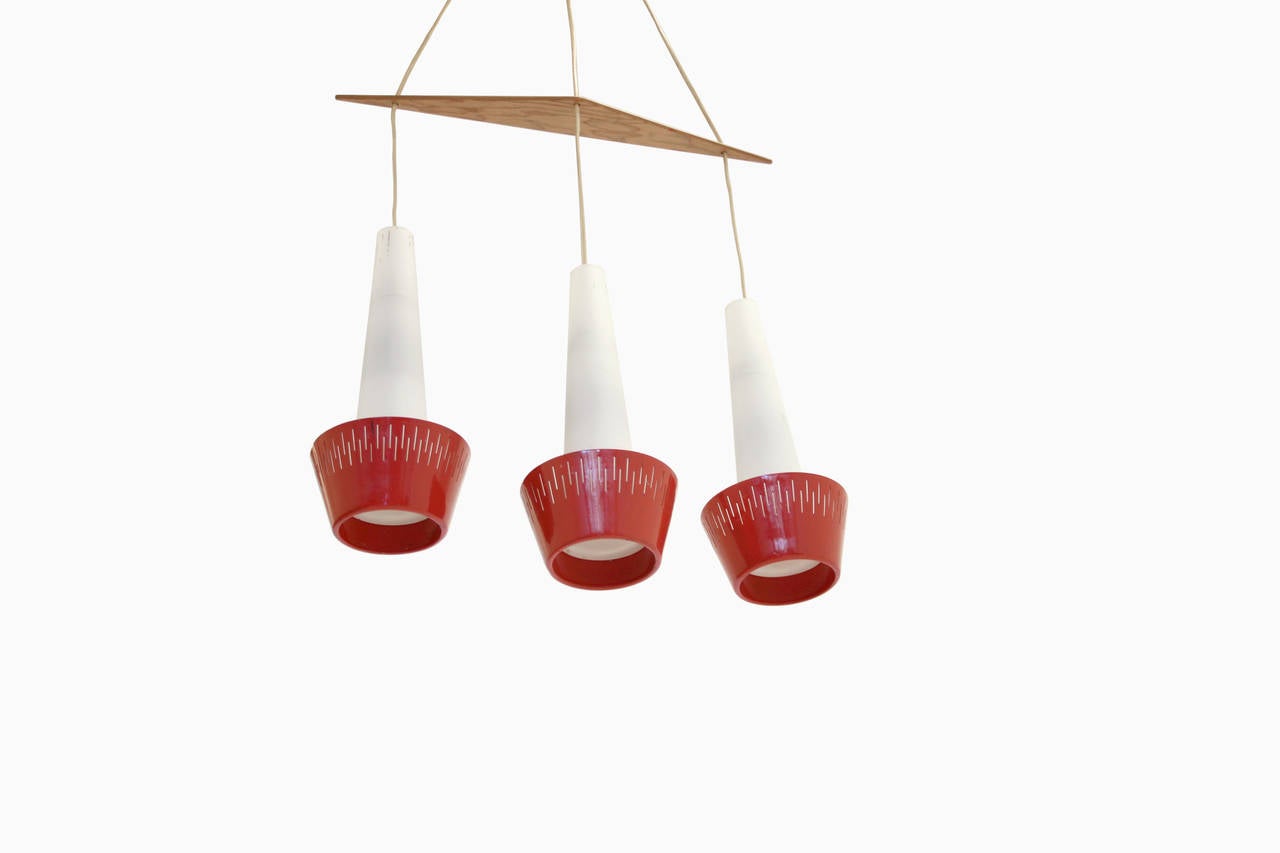 Beautiful midcentury ceiling lamps in steel, wood and opaline glass. Most likely designed and manufactured in Sweden from ca 1960s second half. In good vintage condition.