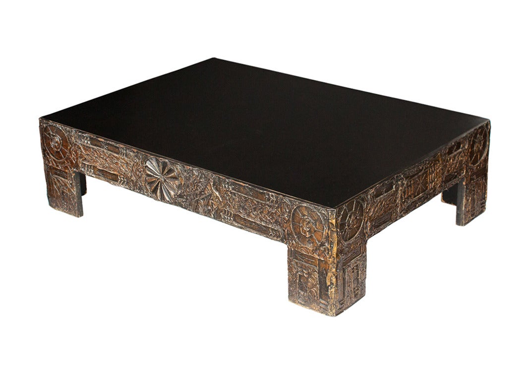 Paying homage to Paul Evans' sculpted bronze series, this Brutalist coffee table by Adrian Pearsall features a black laminate top and nature motifs in a sculpted bronze and black resin. The table is in excellent vintage condition with very minor