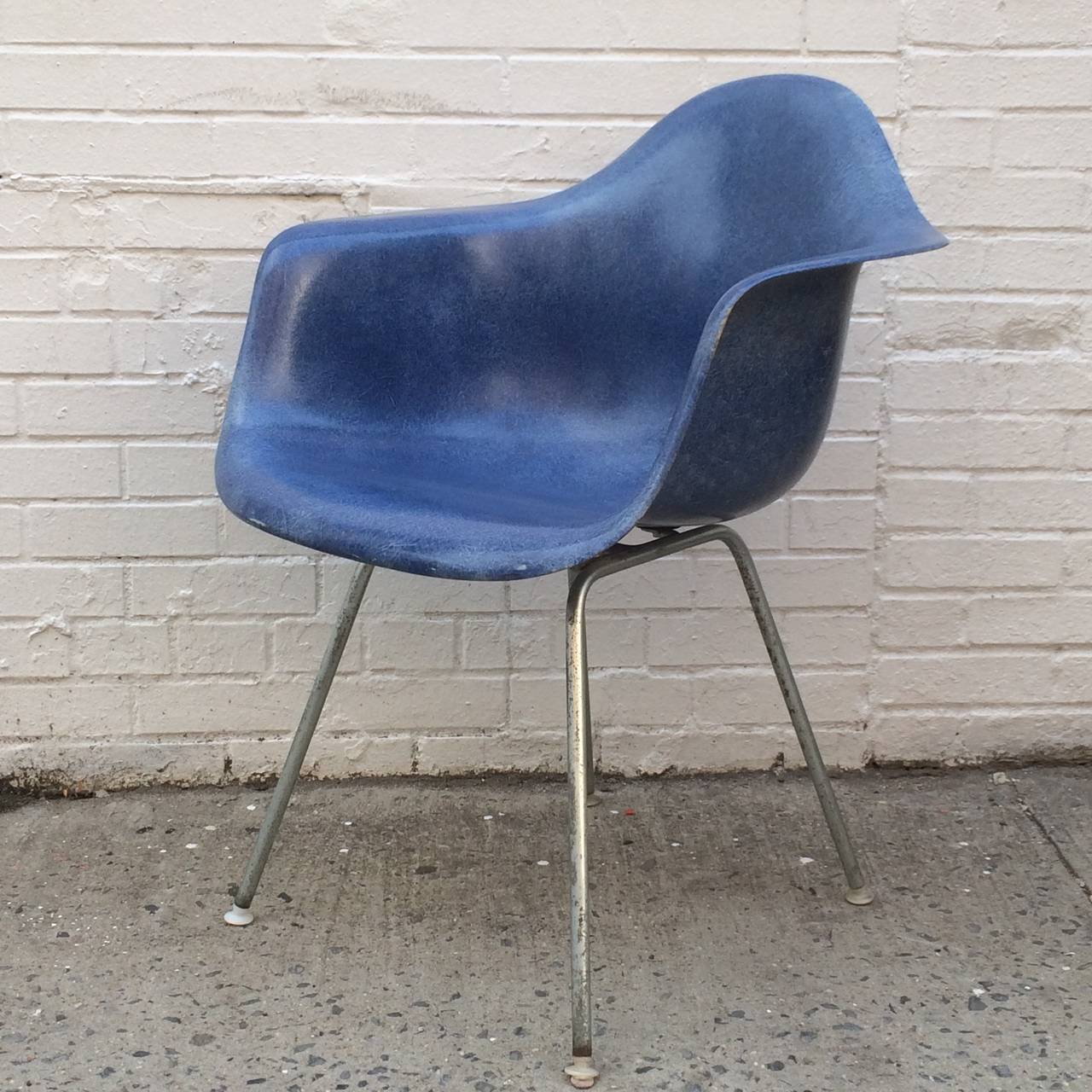 Herman Miller Eames royal blue fiberglass armchair. DAX model. Original base, shock mounts and screws. Normal wear for a chair of this age. No holes. Rare waffling pattern on back pattern is specific only to Herman Miller chairs that came from the