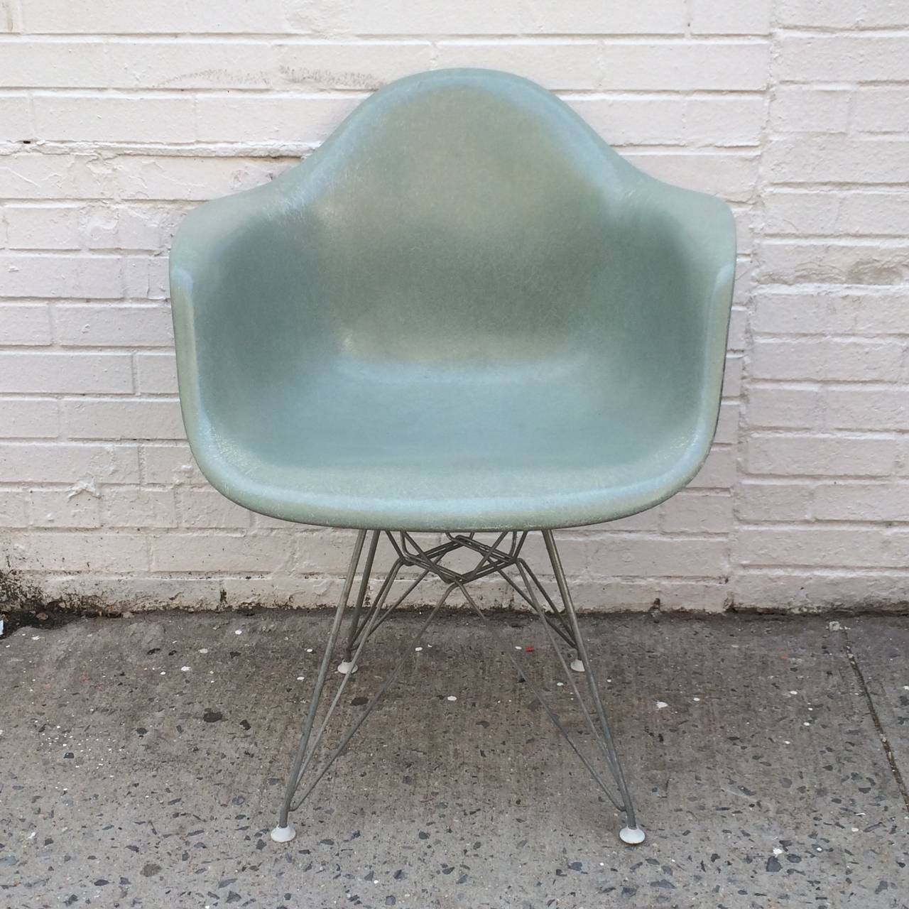 Herman Miller Eames Seafoam Green fiberglass DAR chair. Eiffel base with original glides. Original mounts and screws. Round medallion label. 1950s shell with incredibly high fiber contrast.
