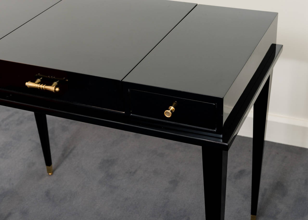 Makeup table by Jacques Adnet, (1901-1984) in sycamore wood, black varnish Piano.
Interior in sycamore wood, handles in bronze and brass for the feet.
This makeup table been realized in the period 1940.