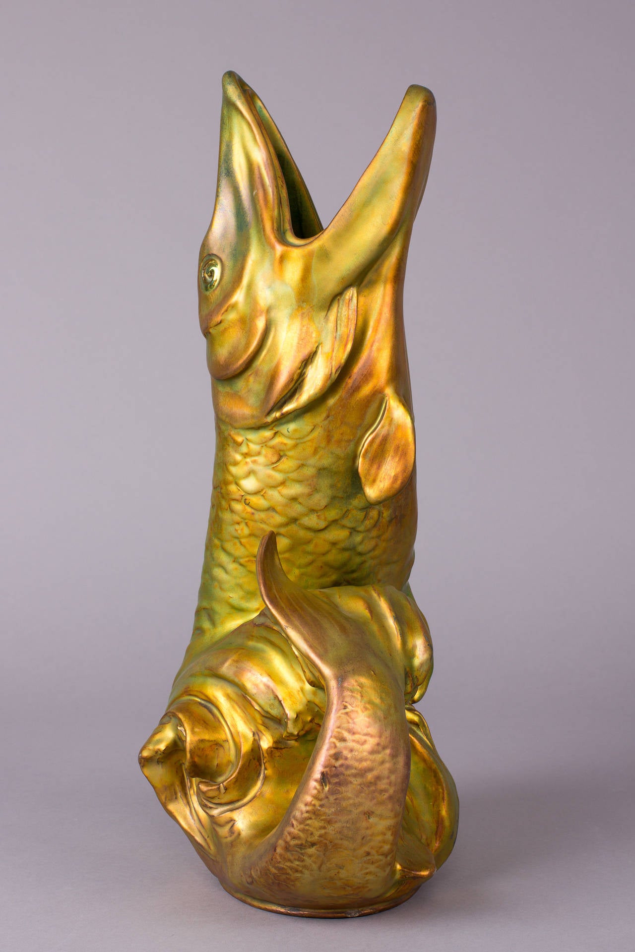 Fish shaped eozine glazed ceramic vase from 1902, by Zsolnay Porcelain Manufactory Pécs, Hungary.

Height: 15.94