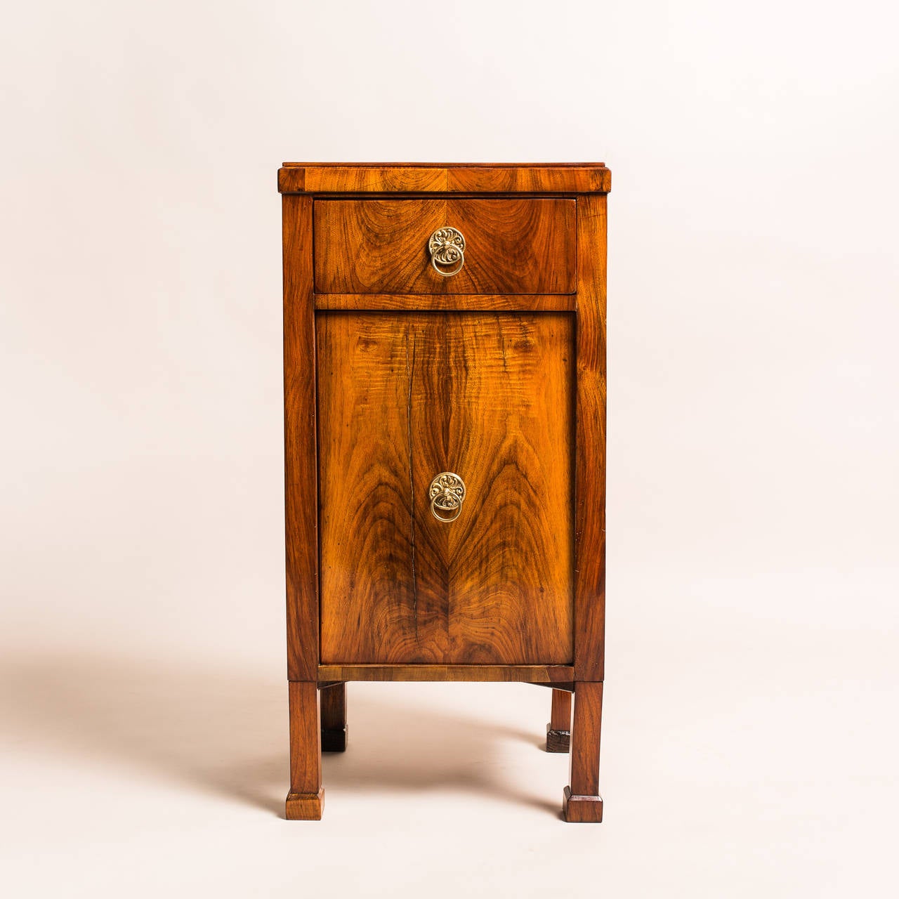 Built in Vienna, Austria, circa 1830, this simple yet elegant small pillar cabinet or nightstand has all the characteristics of the Biedermeier period. Its clean lines and minimal ornamentation add to its charm of expertly crafted spruce wood with a