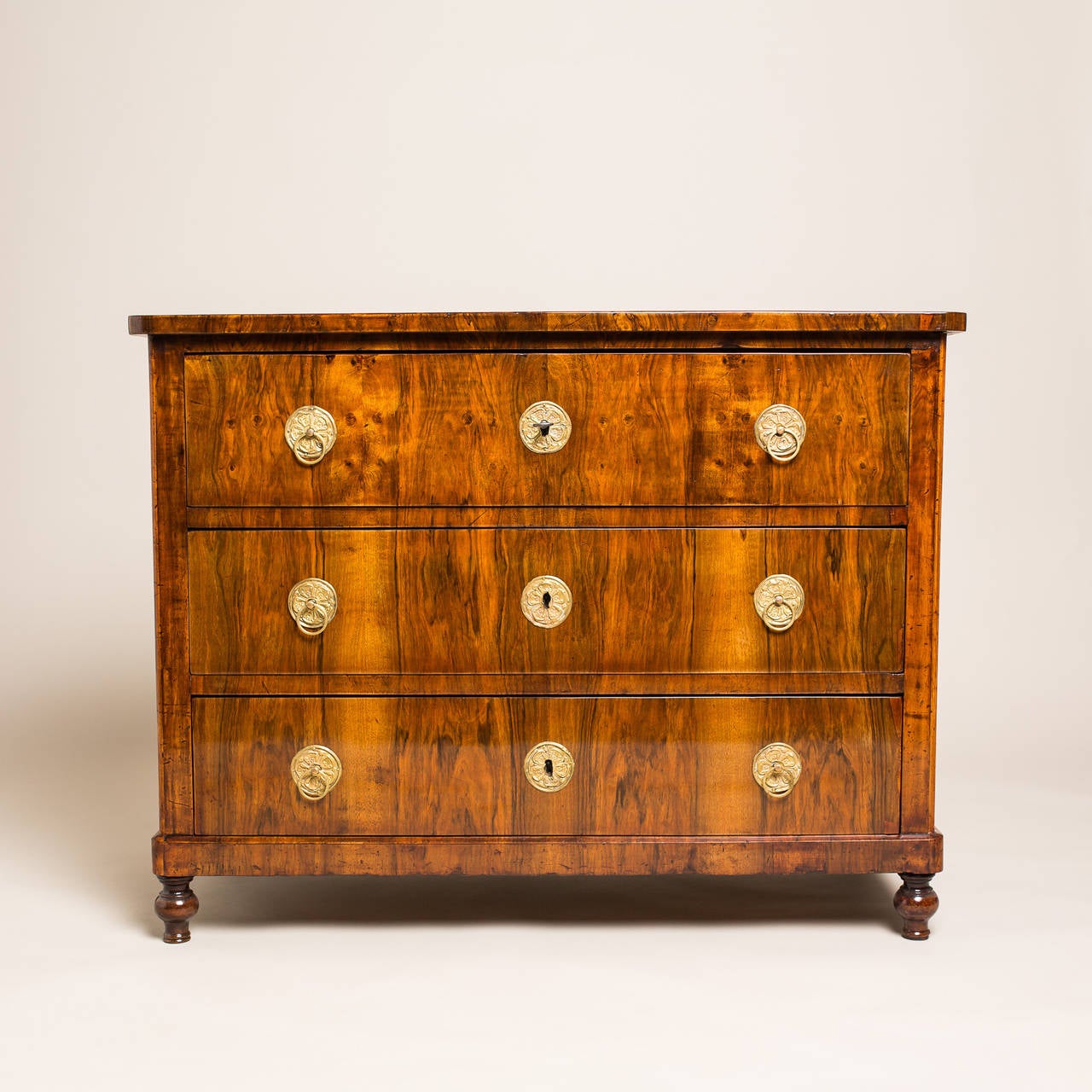 This beautiful Biedermeier chest of drawers is a true timeless Classic from southern Germany, built circa 1830. Functionally, the chest comprises of three large drawers which provide ample storage space. Aesthetically, the chest’s veneer of burl