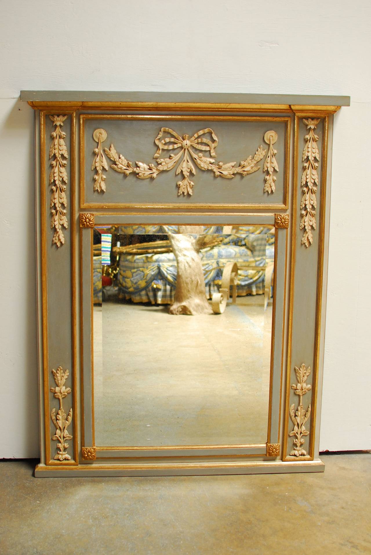 A vintage Louis XVI trumeau mirror by 