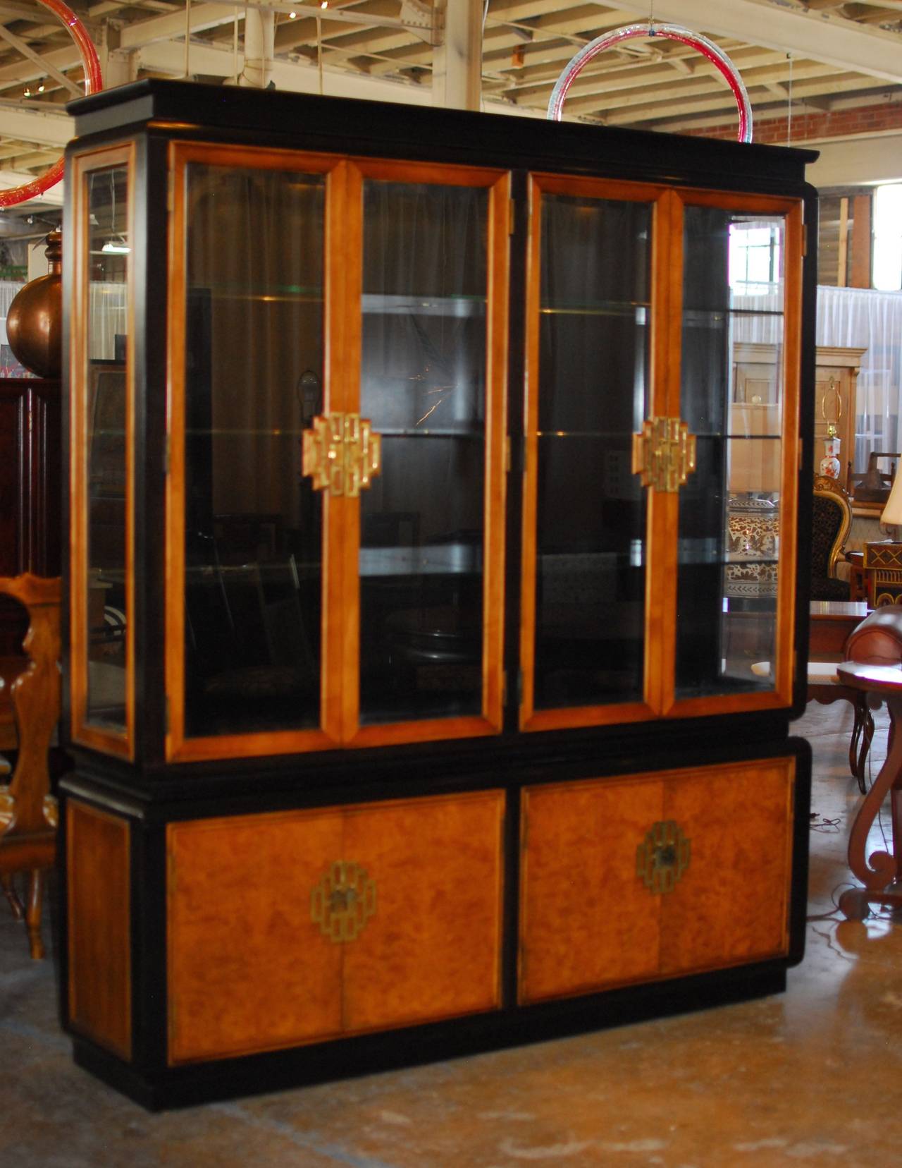A vintage, Chin Hua breakfront china cabinet designed by Raymond Sobota for century Furniture Co. Classic chinoiserie style made of the finest wood from around the world. White ash burl from France, Primavera from Guatemala and solid Maple from the