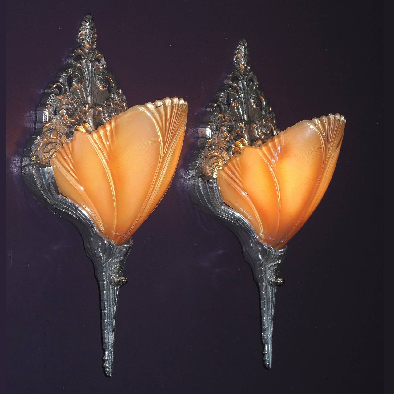 Truly spectacular and very rare (only ones we have ever had) pair of slip shade vintage wall sconces. You do not see many examples of wall lighting with the attention to detail and design which these fixtures posses. A rich plethora of Art Deco