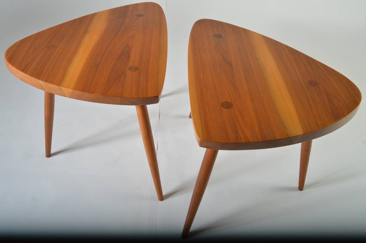 An original pair of George Nakashima Wohl tables. Beautiful, matched grain with natural wood construction. 
 Copy of original sales receipt is included along with certificate of authenticity signed by Mira Nakashima.
