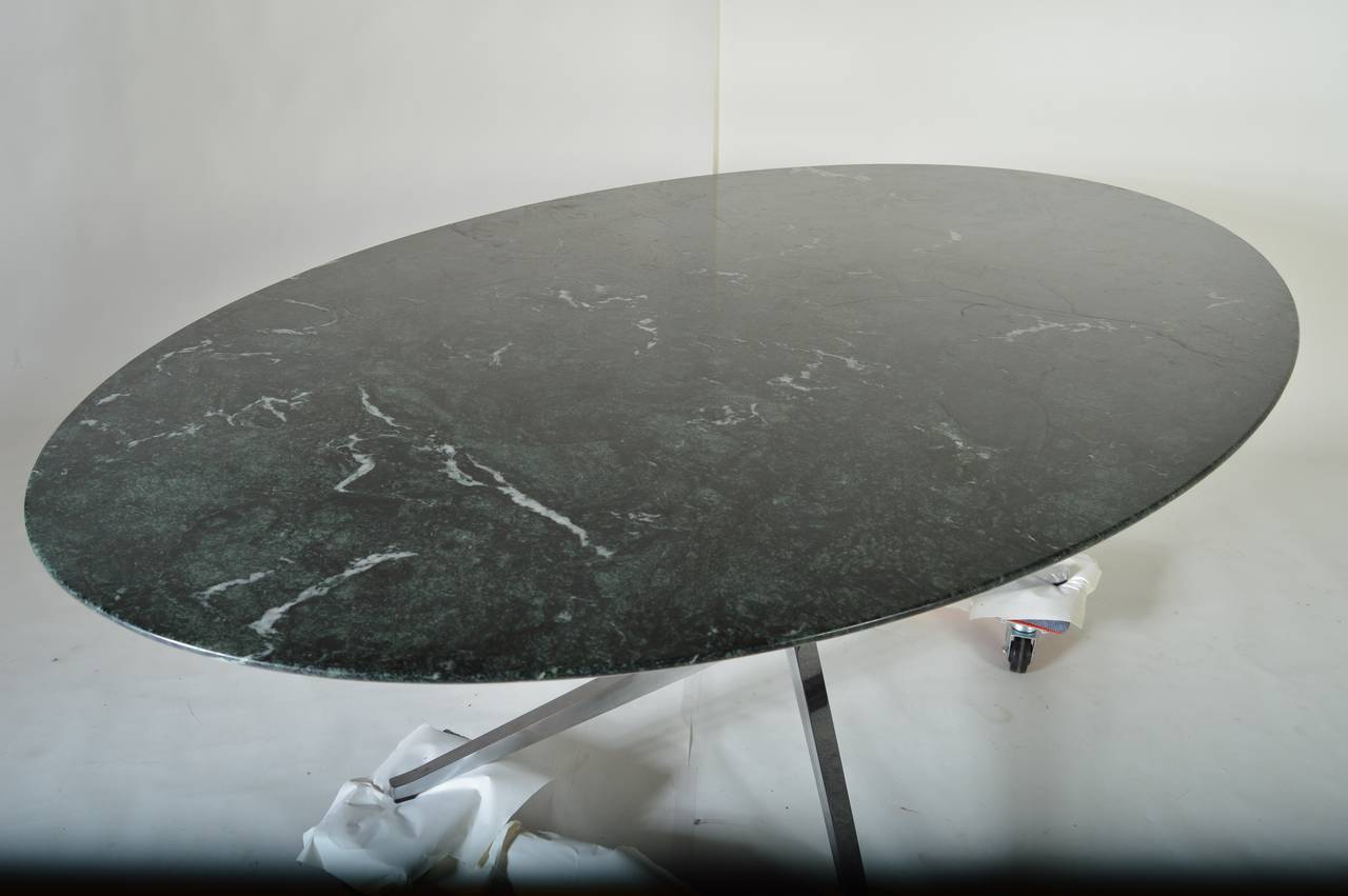 Florence Knoll oval dining table in rare, green Verde marble. Original Knoll International tag is present.
An absolutely stunning table.