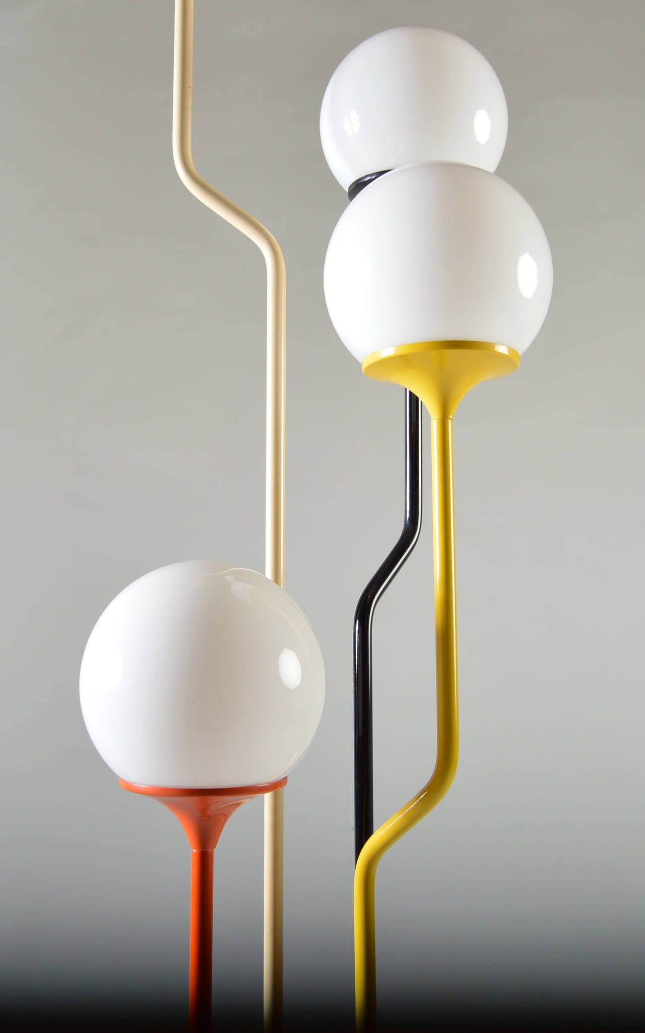 An original multicolored floor lamp designed by Goffredo Reggiani. Four-way light switch that is triggered at the base.