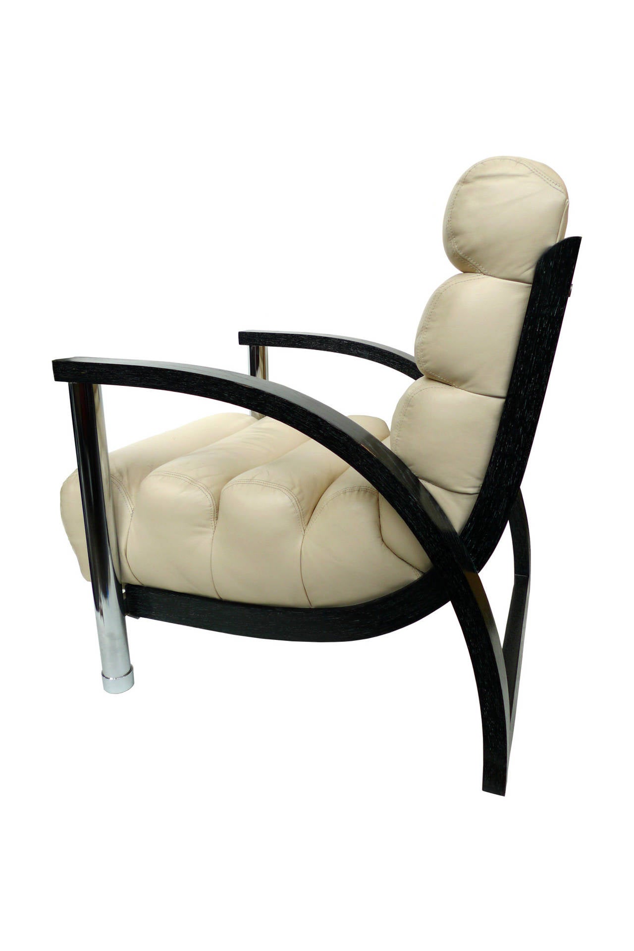 These handsome lounge chairs are designed by Jay Spectre, renowned for his hybrid furniture incorporating hard and soft materials and pulling from Art Deco and modern designs. These eclipse chairs have cerused oak arms and frames, chromed steel