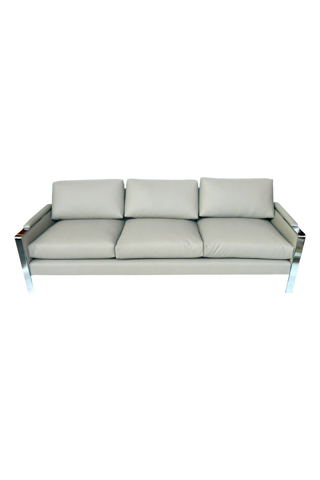 This Milo Baughman single sofa is newly reupholstered in a warm gray supple vinyl. It has a well-tailored look and exemplifies Baughman's modernist design with its clean lines and edges. The base and arms are chrome with matching vinyl cushioned
