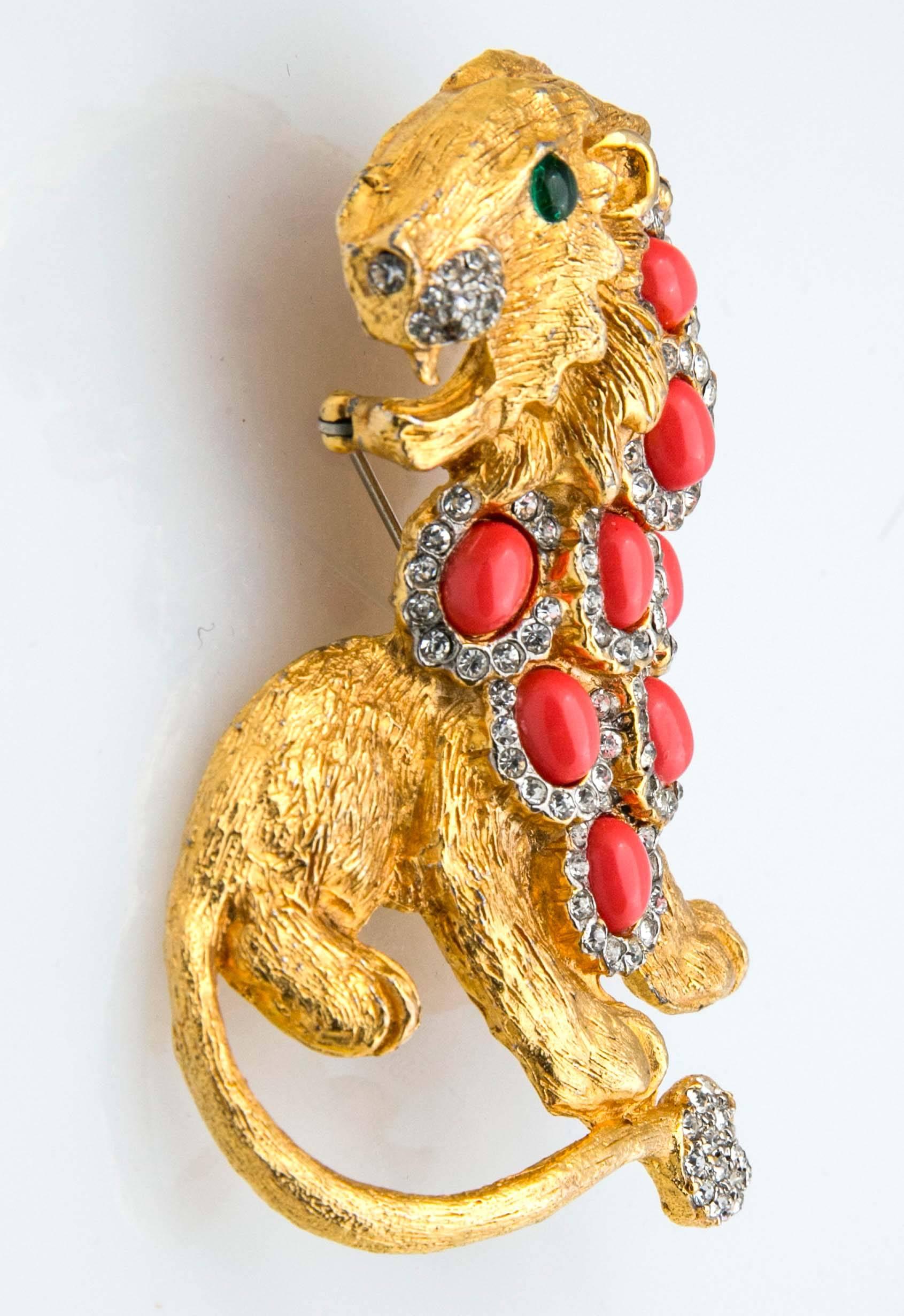 Early Kenneth Jay Lane lion brooch. All original stones including faux oval cabochon coral stones, green emerald eyes and pavé diamond detail. Never worn.  