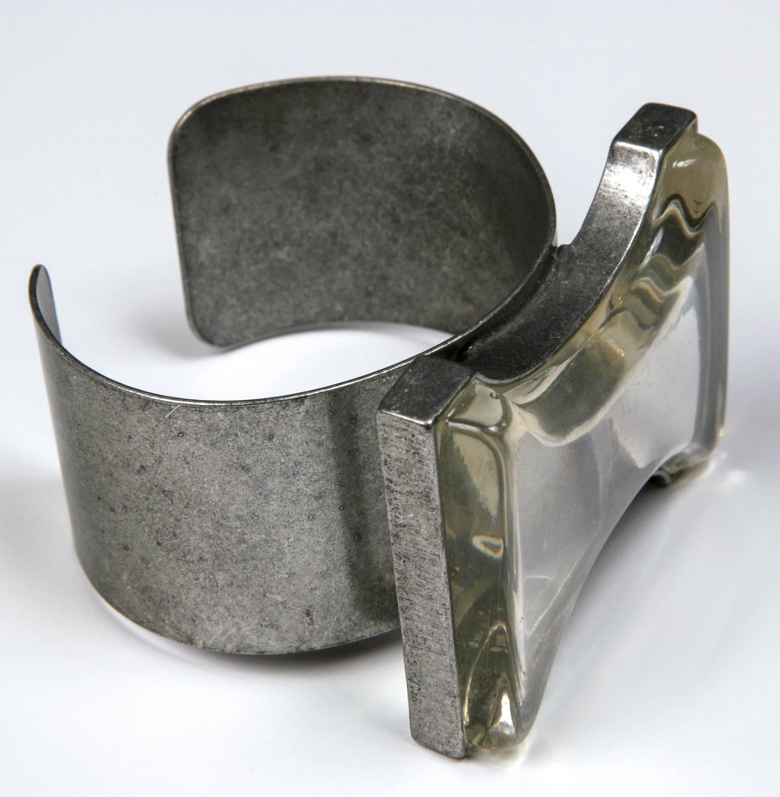 Limited edition statement cuff features a hefty chunk of lucite on matte silver surround. From the 1970's artisan era in San Francisco. Brilliantly designed and tapered so it's comfortable on the wrist.