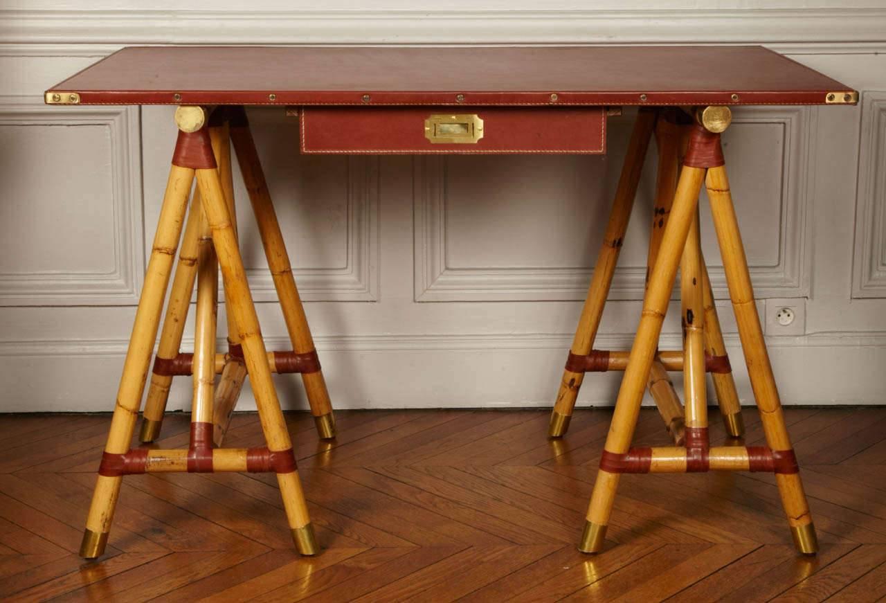 Rare Campaign desk with real bamboo feet and cognac stitched leather.