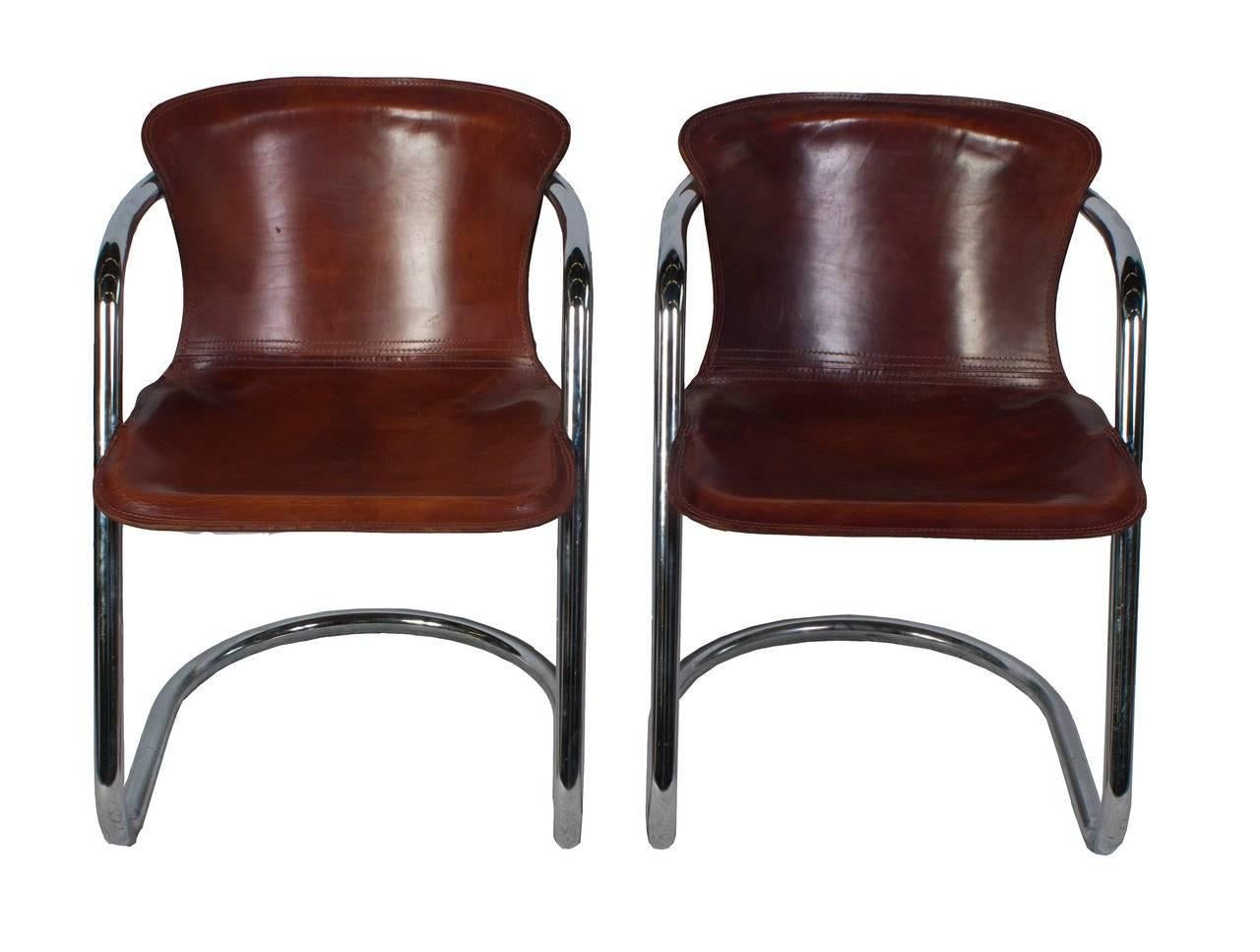 A set of Willy Rizzo dining chair with cognac leather.