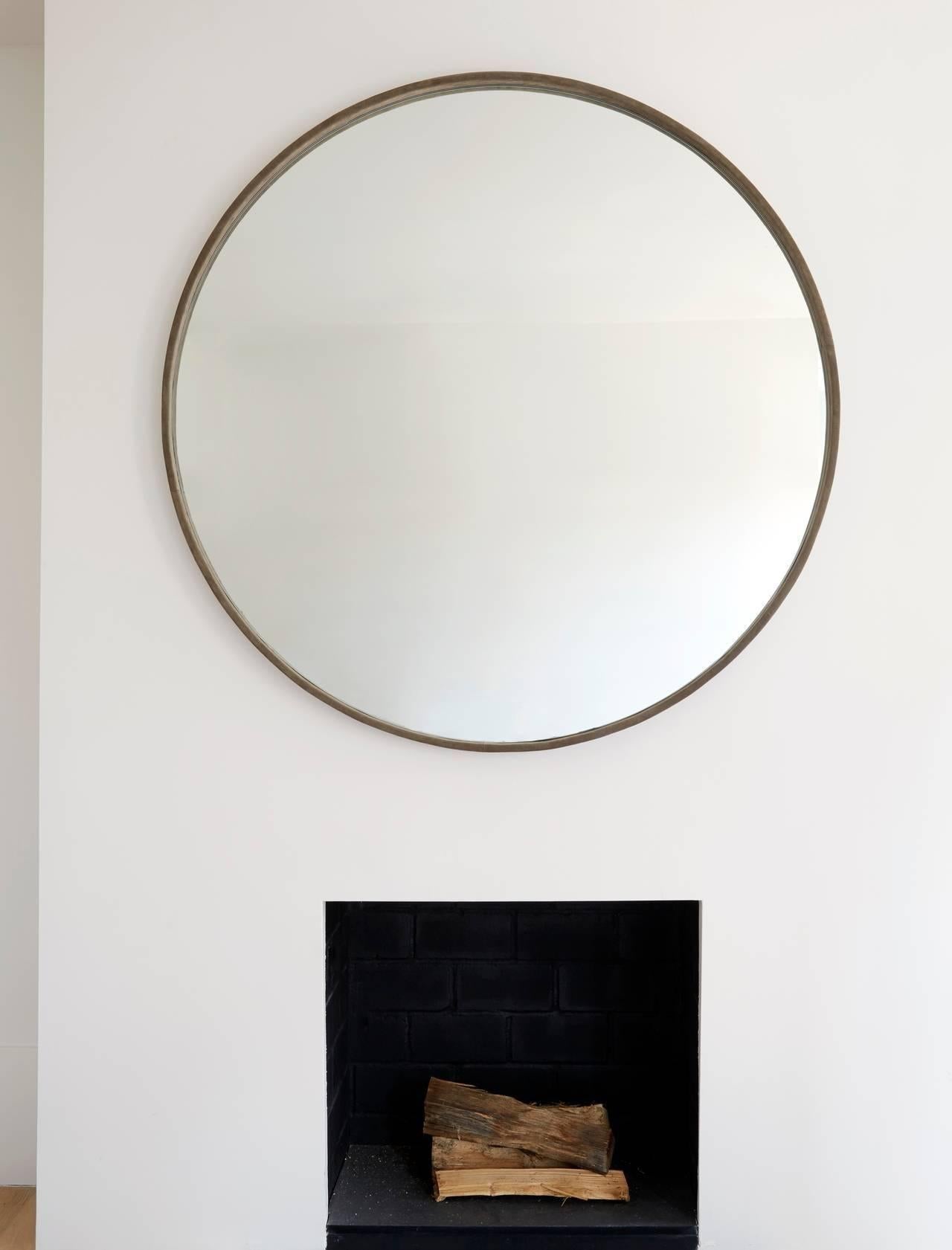 Elegant and simple. Suede mirror with cleat to hang. (Grey pictured)
Measures:
Diameter 48