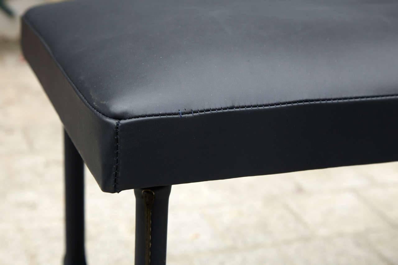 Black stitched leather bench.