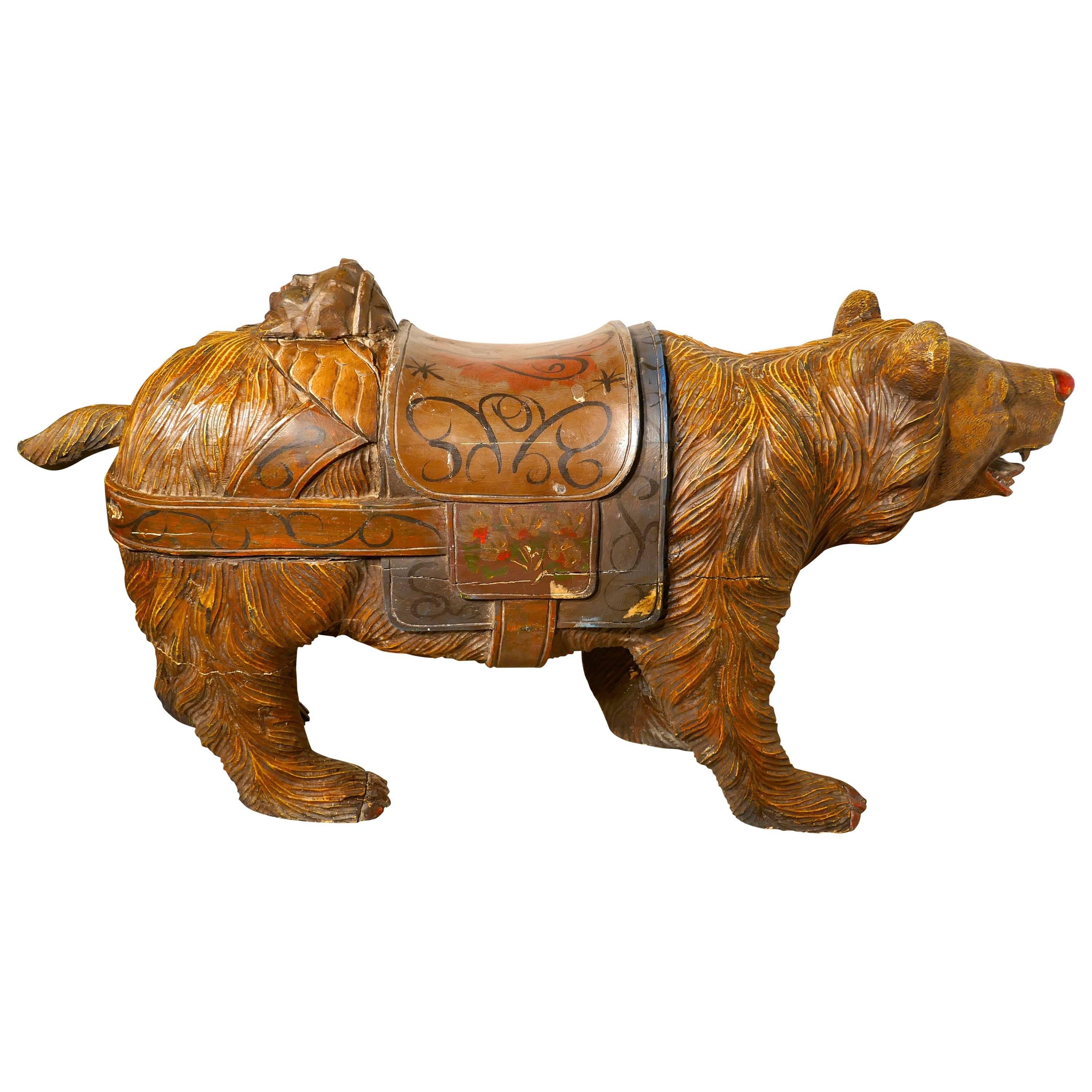 This charming if somewhat fearsome beast is a 19th century carved wooden bear he originates from the Black Forrest and has has detailed carving with Folk Art painted decoration
Our bear comes from a country merry go round or carousel, he is made