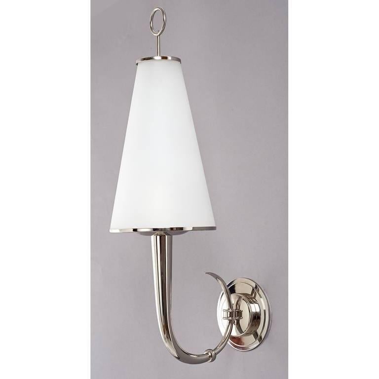 Roberto Rida (1943).
Pair of nickeled brass sconces with frosted glass shade and ring decor.
Italy, 2014.
Dimensions:  21 H x 6 W x 8.5 D 
Wired for use in the U.S.