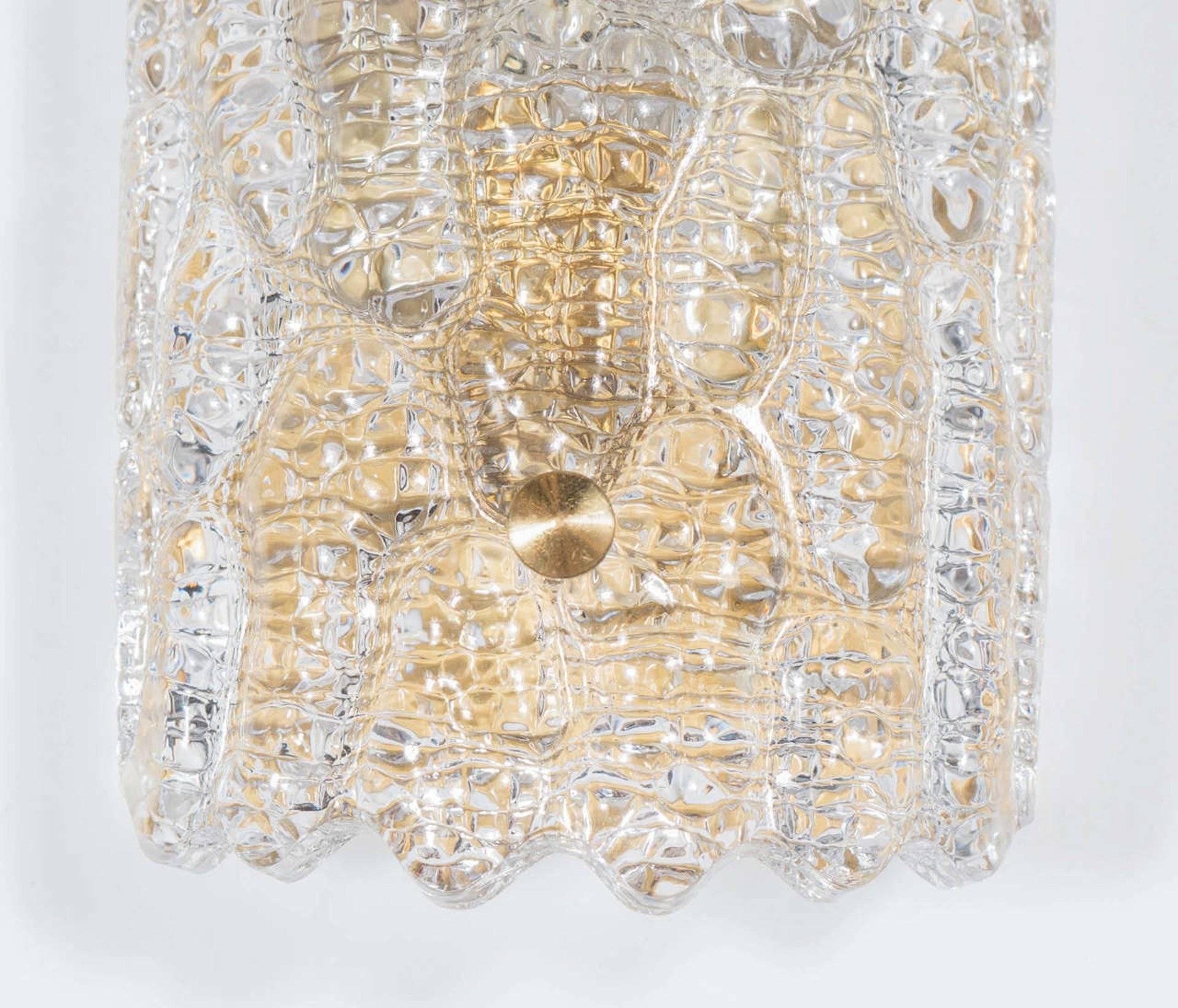 Pair of shield form crystal sconces with a stylized embossed crocodile pattern on satin brass frames. Rewired for use in the USA.