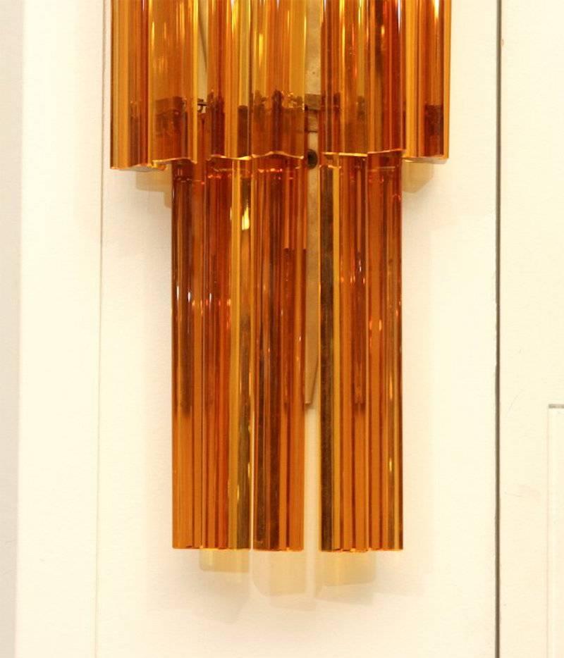 Three-tier multi dangle Amber prisms.