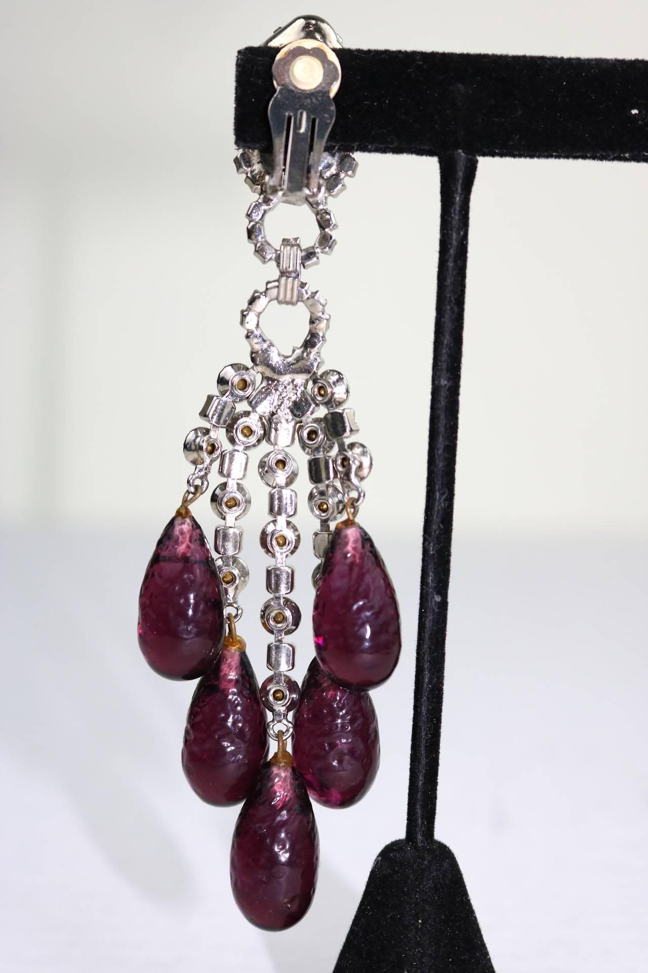 Spectacular runway shoulder-duster one of a kind chandelier drop earrings by Robert Sorrell. The Crystal Amethyst Briolettes Drops from faceted sparkly Faux Diamonds in a silver-tone setting. In very good condition, these clip earrings measure 5