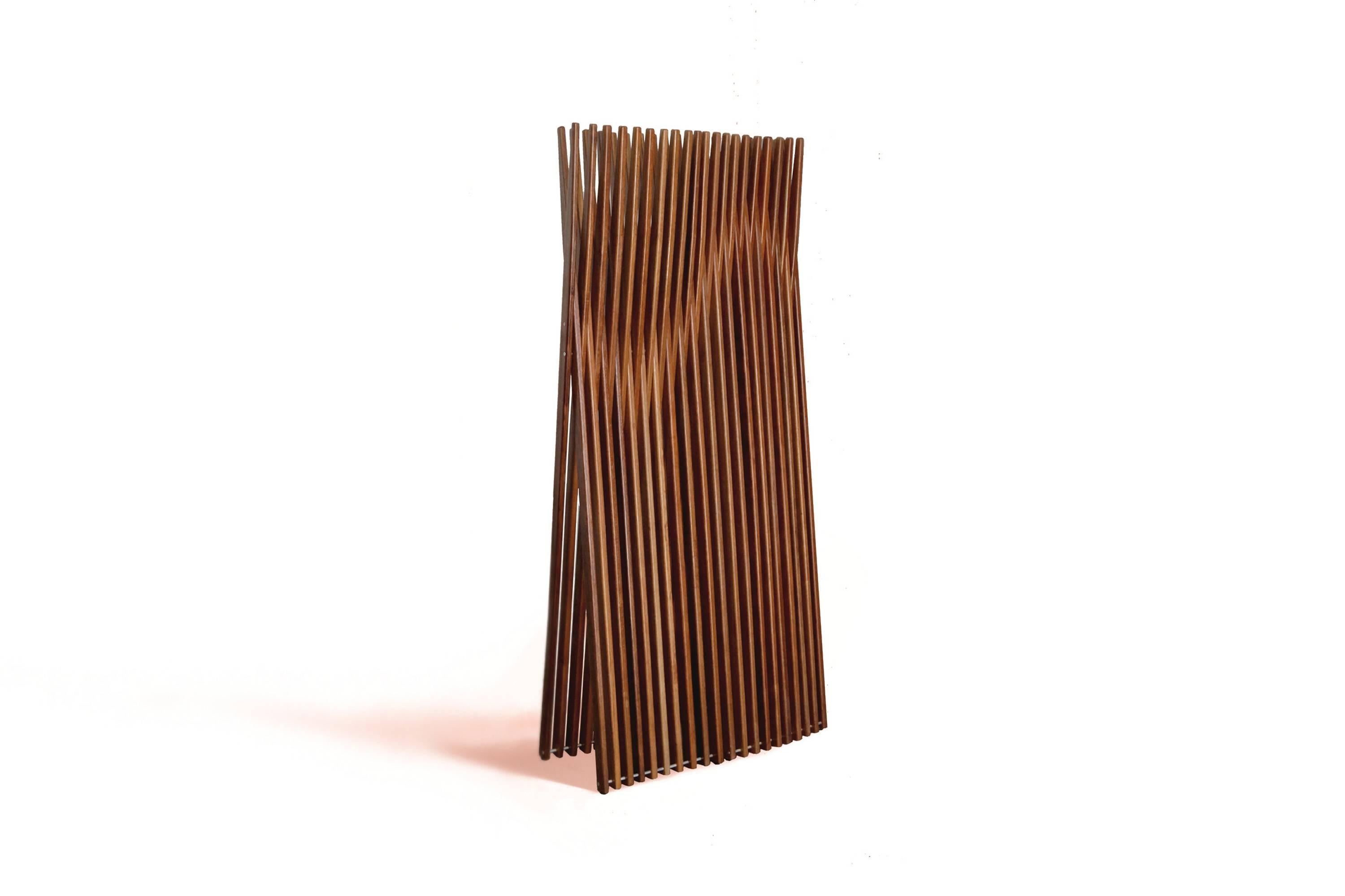 This contemporary styled partition screen or room divider is made of sucupira hardwood. Named the Conogó, this partition screen is art–furniture.

The  constructive and aesthetic inspiration for this room divider is a mix of references that goes