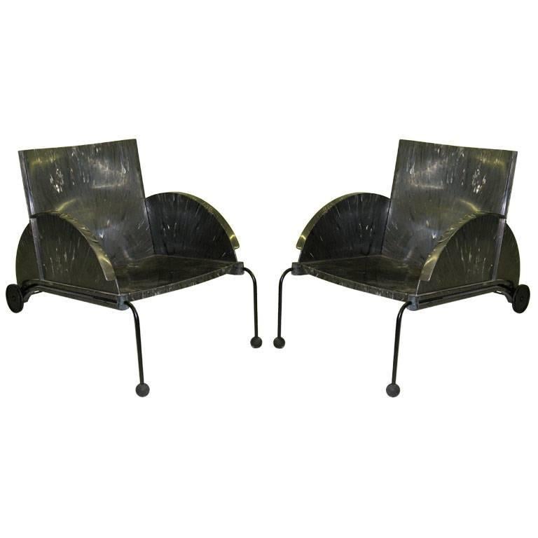 Comfortable, chic pair of Italian Mid-Century Modern lounge /club chairs / armchairs by Castelli Ferrieri for Kartell featuring both innovative design and a mix of recycled poly materials. The all weather materials allow the chairs to be used in and