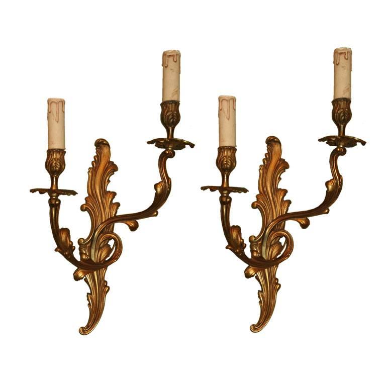 Pair of French 1920s Gilt Louis XV Style Sconces For Sale