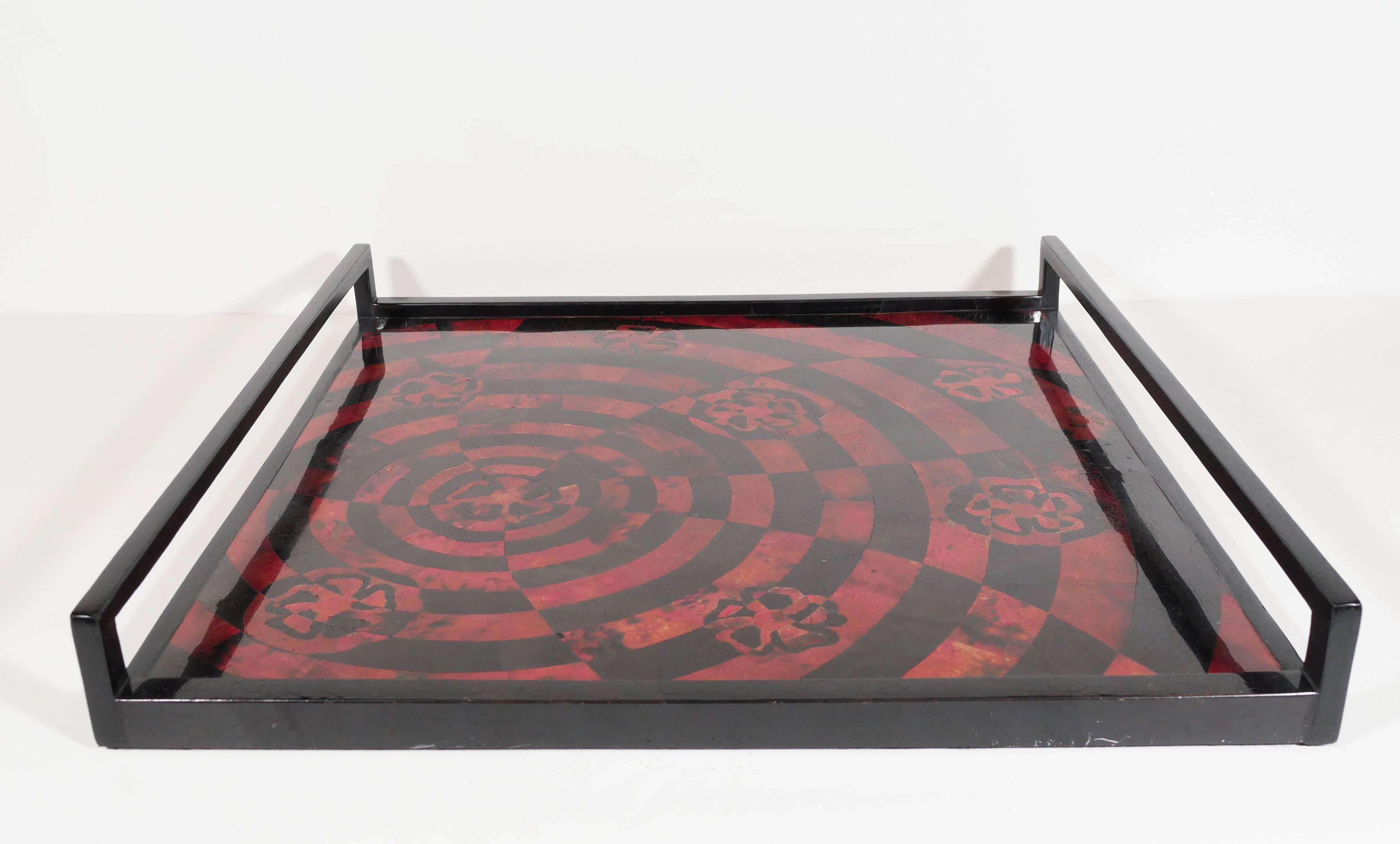 Exotic pen shell tray in opulent tones of red and black.  Hand-dyed and lacquered, featuring mosaic inlay top with geometric patterns. Handcrafted with handles in ebonized palmwood. Excellent addition to any barware set, or as a decorative tabletop