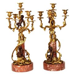 Unusual Pair of Patinated and Gilt Bronze Figural Candelabras on Marble Base