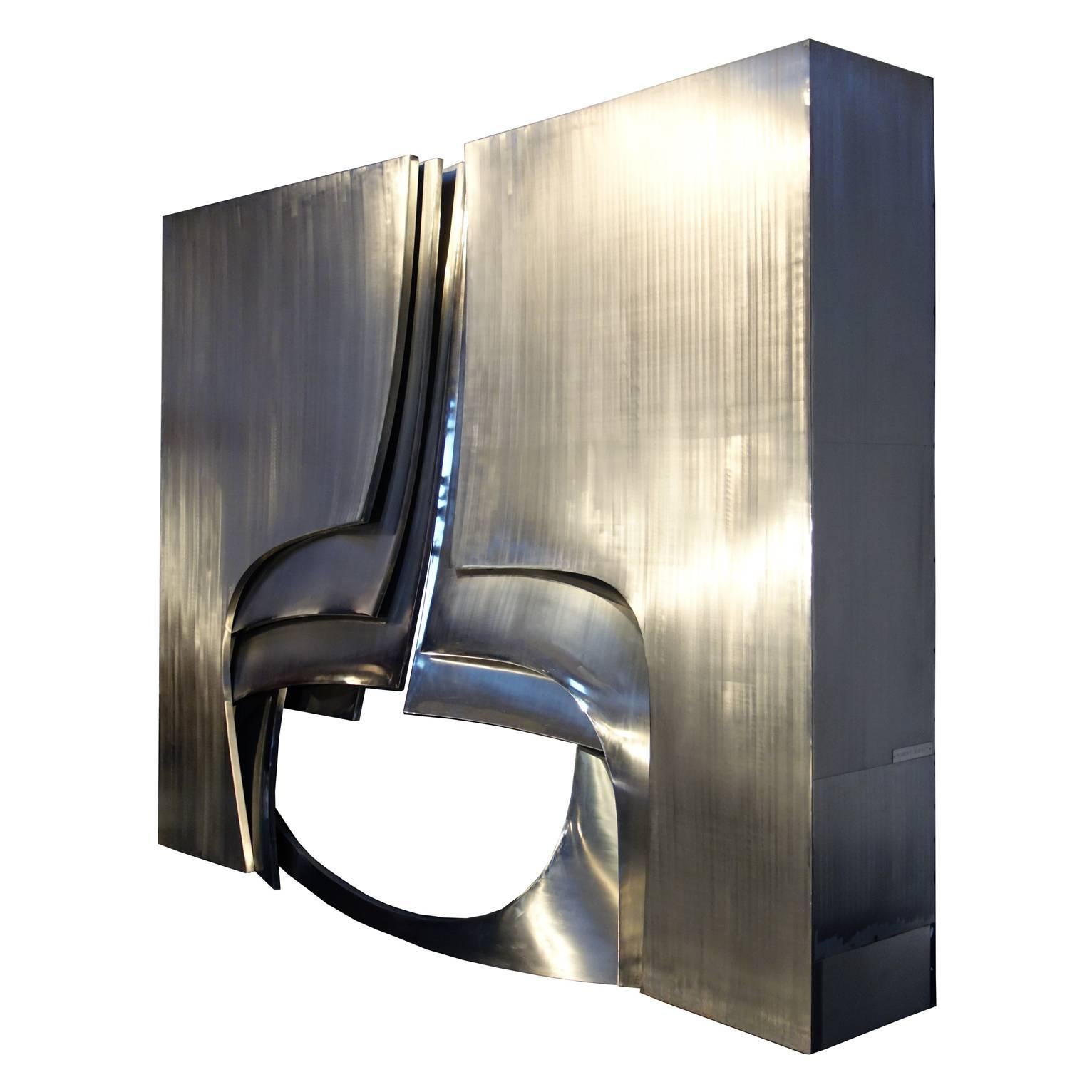 Magnificent steel mantelpiece created by Robert Rigaut, a french sculptor.
Commissioned by on of the most prominent Italian art collector a for his private home in Megève.

Brushed steel surfaces and polished highlights are combined to form a