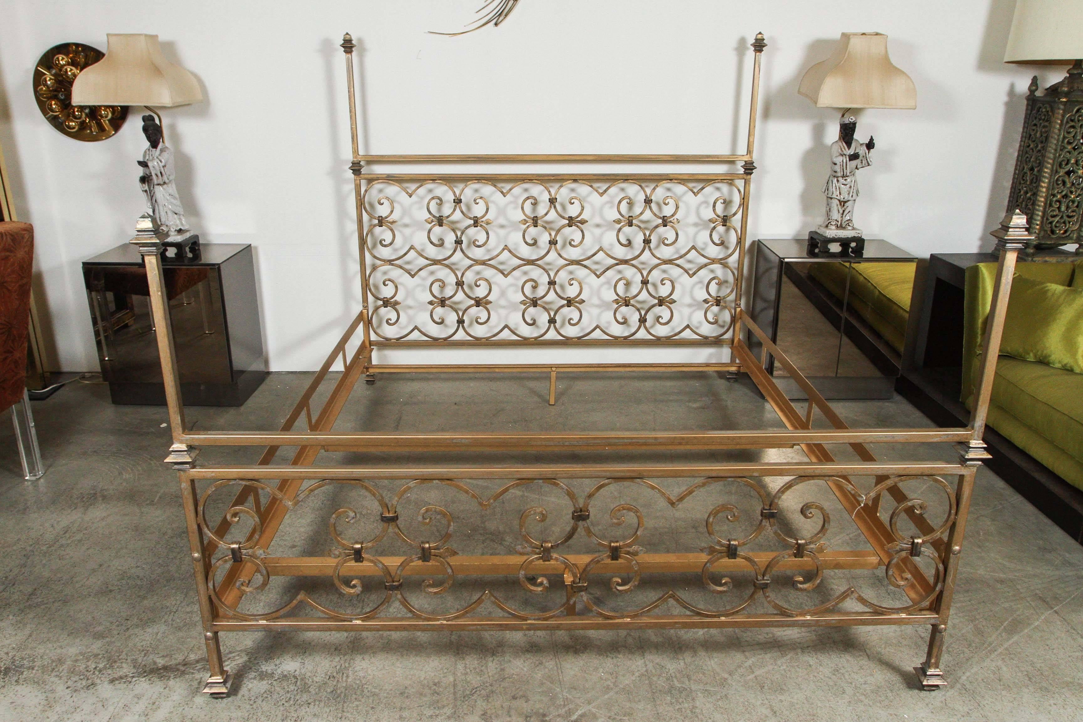 Hollywood Regency bed with decorative scrollwork in the style of Nancy Corzine.
The steel construction is heavy and very sturdy with wonderful detailing to the head and foot boards.
The painted finish in shades of gold, tan and gray has a mottled