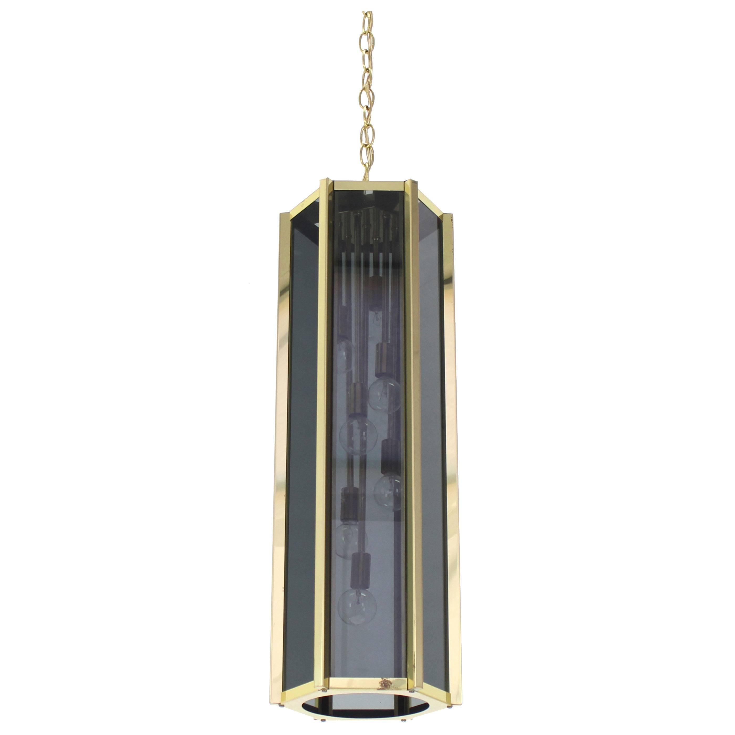 Tall and Narrow Smoked Glass and Brass Pendant Light Fixture For Sale