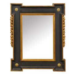 Black and Giltwood Flemish Style Mirror with Carved Floral and Foliage Motifs