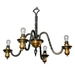 Four-Arm Wrought Iron and Brass Chandelier in the Style of Gilbert Poillerat